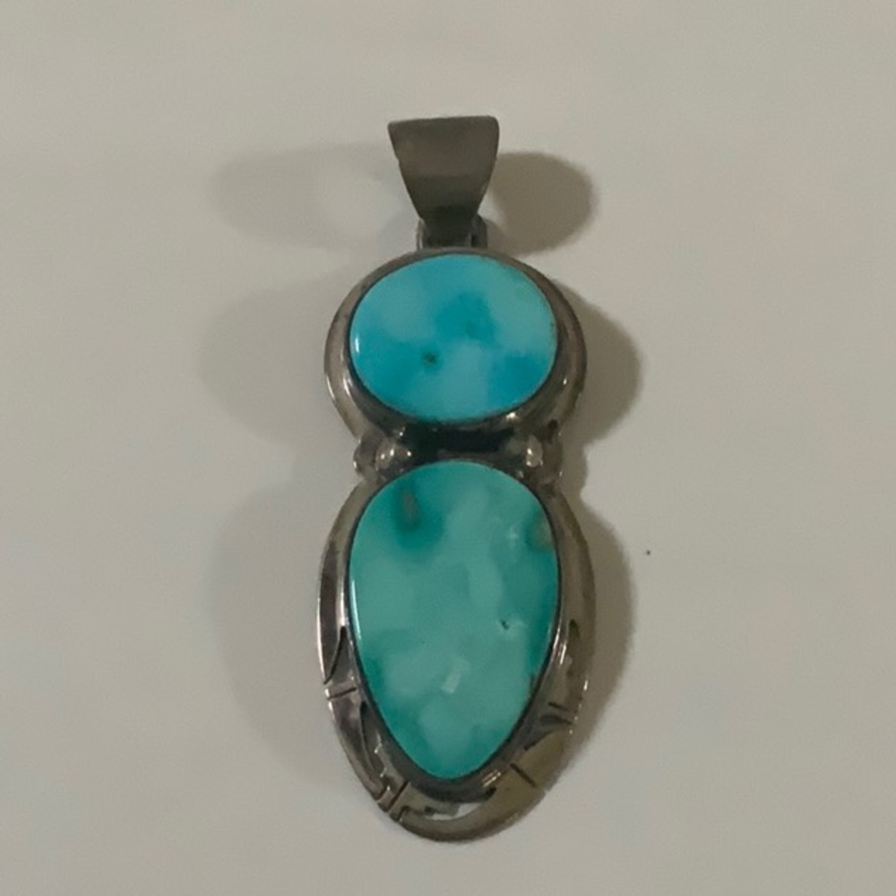 This is a double turquoise pendant